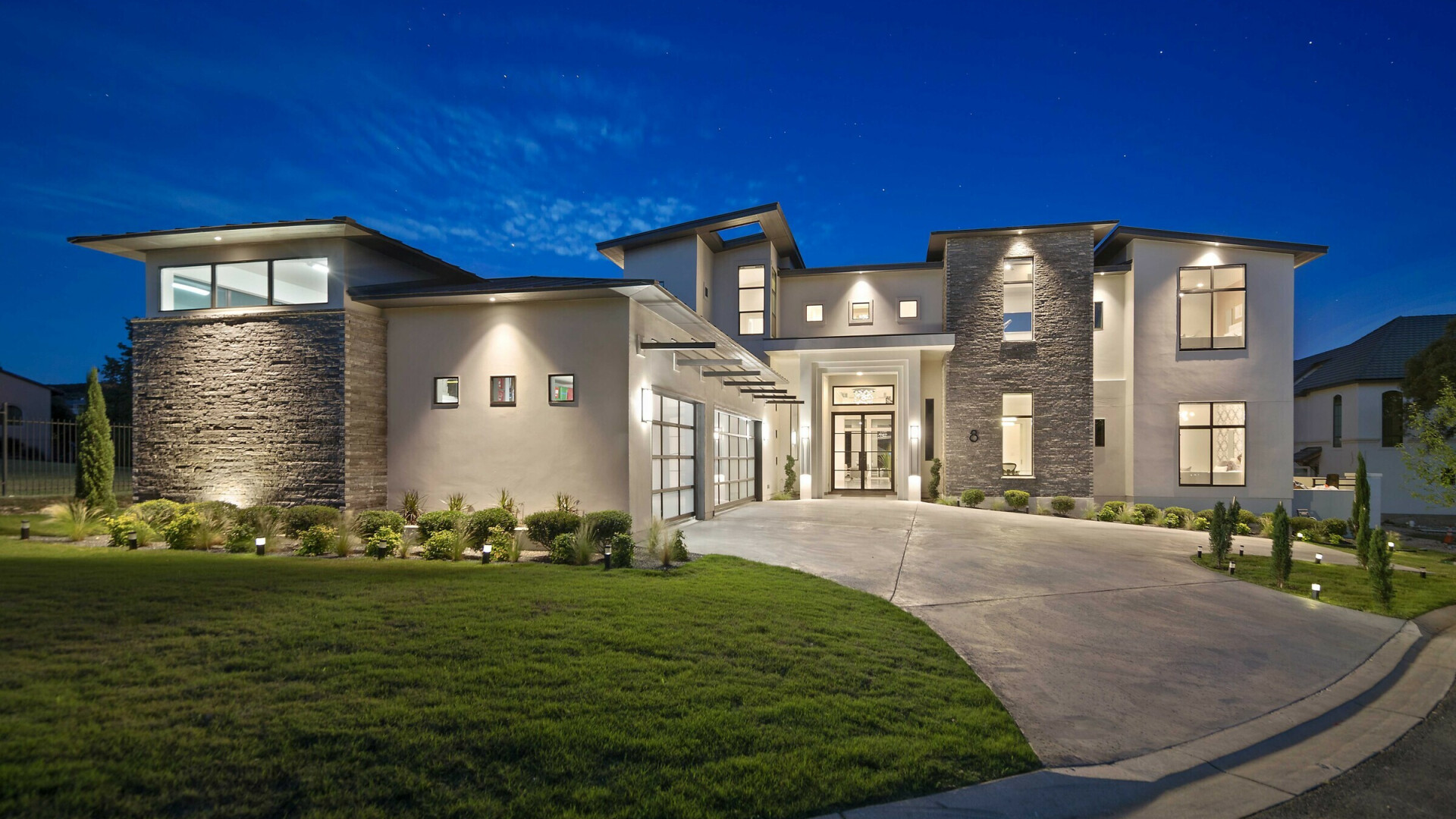 Front view of modern luxury home at twilight, San Antonio TX